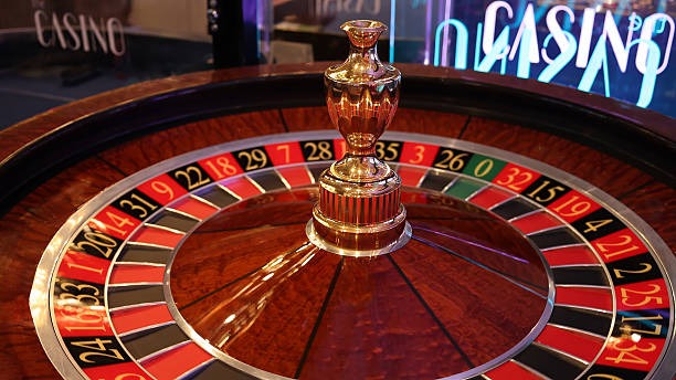 ananta interface showing active Liga 1 match display and live baccarat lobby side-by-side